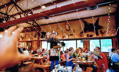 Blazin' M Chuckwagon Dinner & Western Show - Biscuit Toss during dinner.